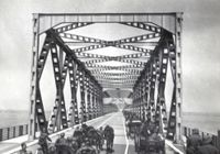 An interesting capture of a large German manpower and equipment crossing the Moerdijk traffic bridge.